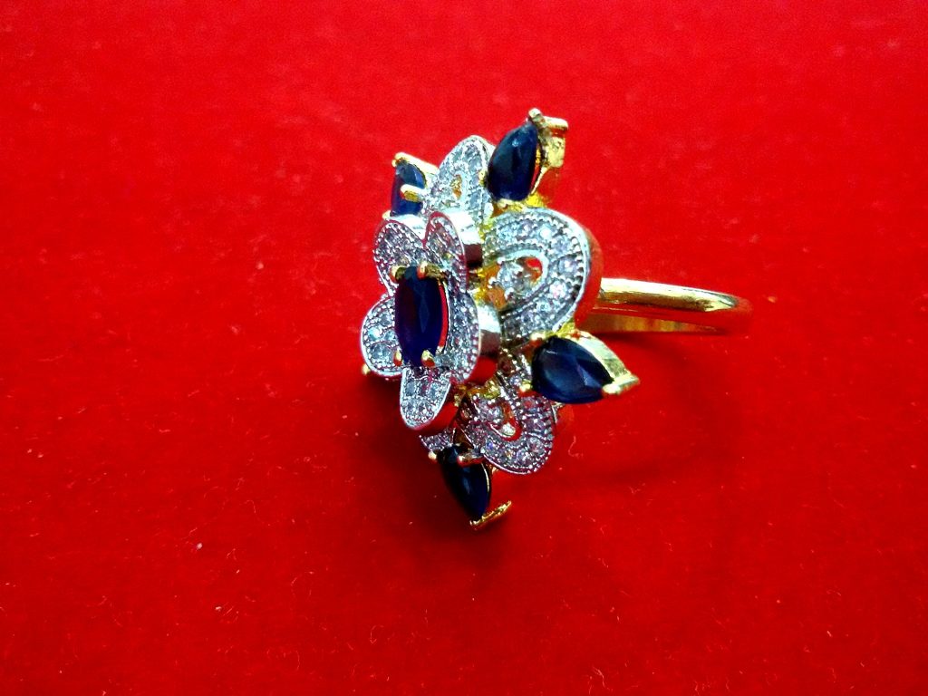 Daphne Gold Plated Unique Ring With American Diamond And Blue Color Stone Side Looks